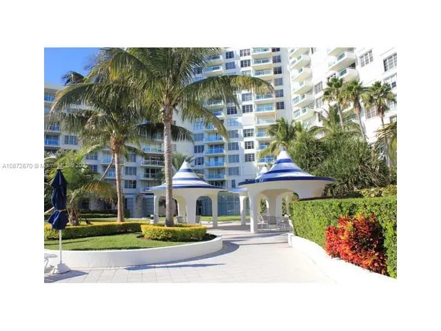 a view of a swimming pool and a yard