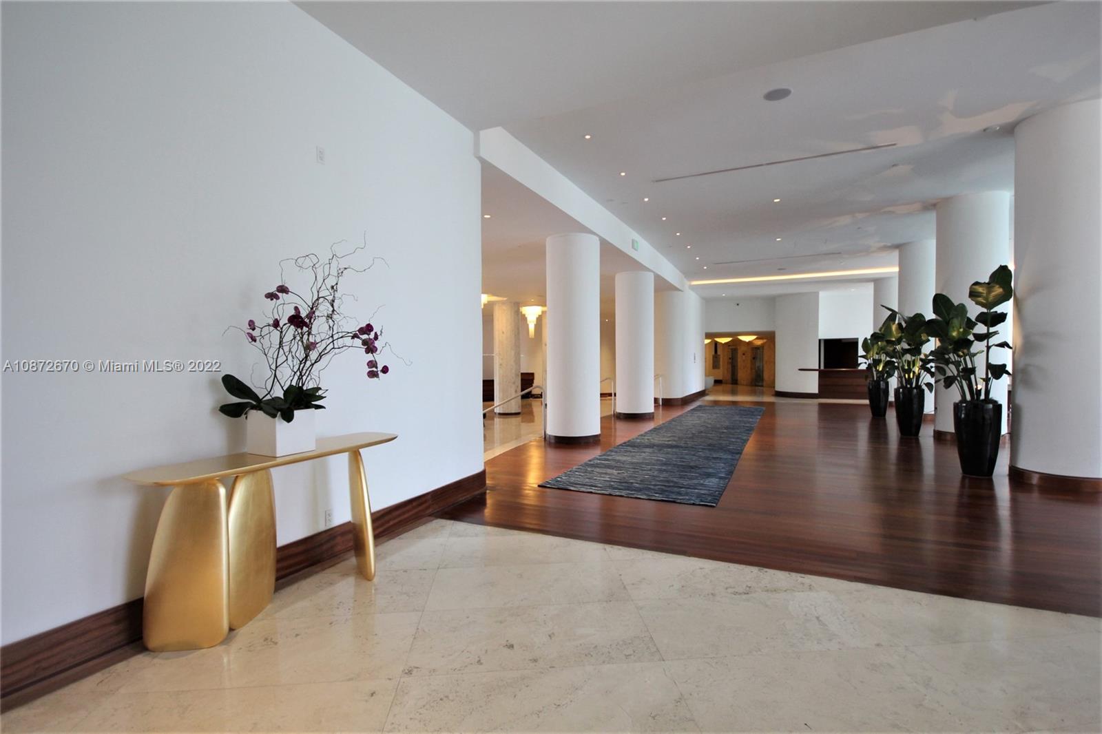 5161 Collins Avenue, Unit 902 Miami Beach, FL 33140 - Photo 35 of 43 a view of an entryway with wooden floor