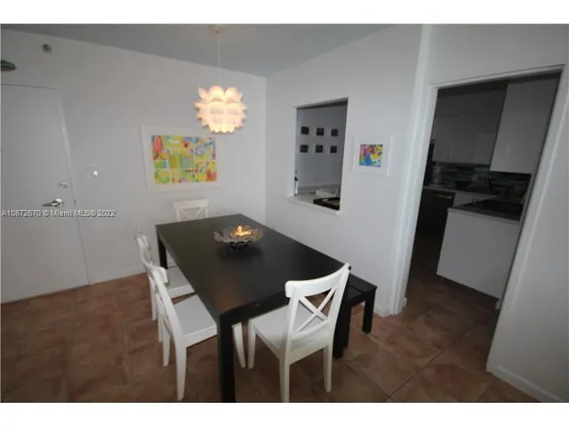 a kitchen with a refrigerator sink and stove