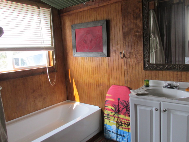 92-8629 Koa Lane Ocean View, HI 96704 - Photo 3 of 12 a bathroom with a bathtub and shower