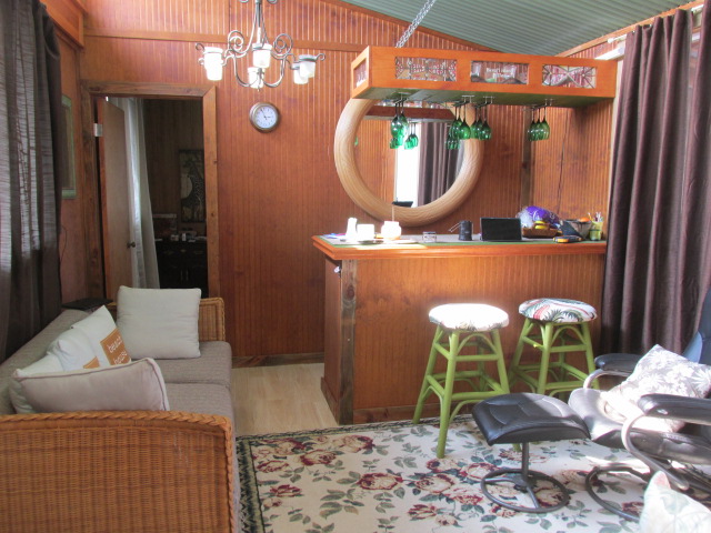 92-8629 Koa Lane Ocean View, HI 96704 - Photo 5 of 12 a living room with furniture and a mirror