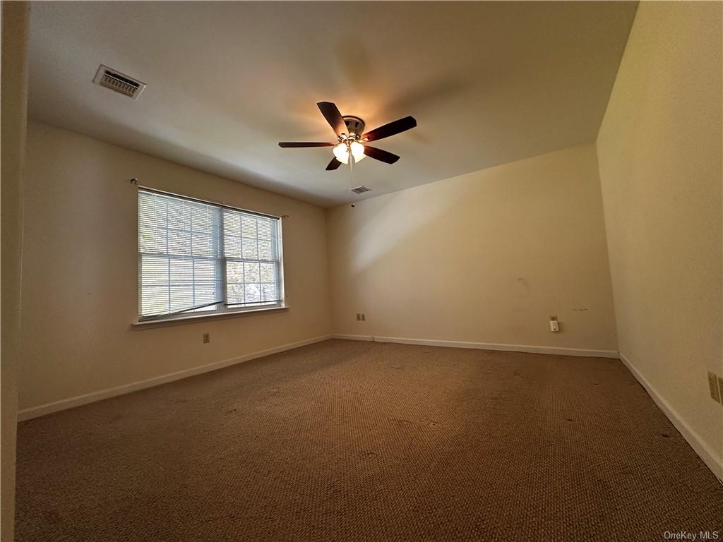 105 South Montgomery Street, Unit B1 4 Walden, NY 12586 - Photo 13 of 20 Carpeted empty room featuring ceiling fan
