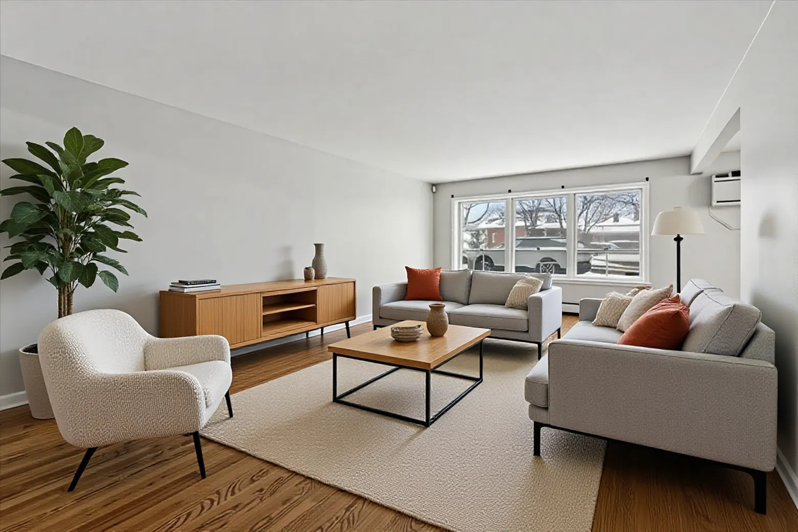7801 Niles Center Road, Unit 102 Skokie, IL 60077 - Photo 2 of 20 a living room with furniture and a potted plant