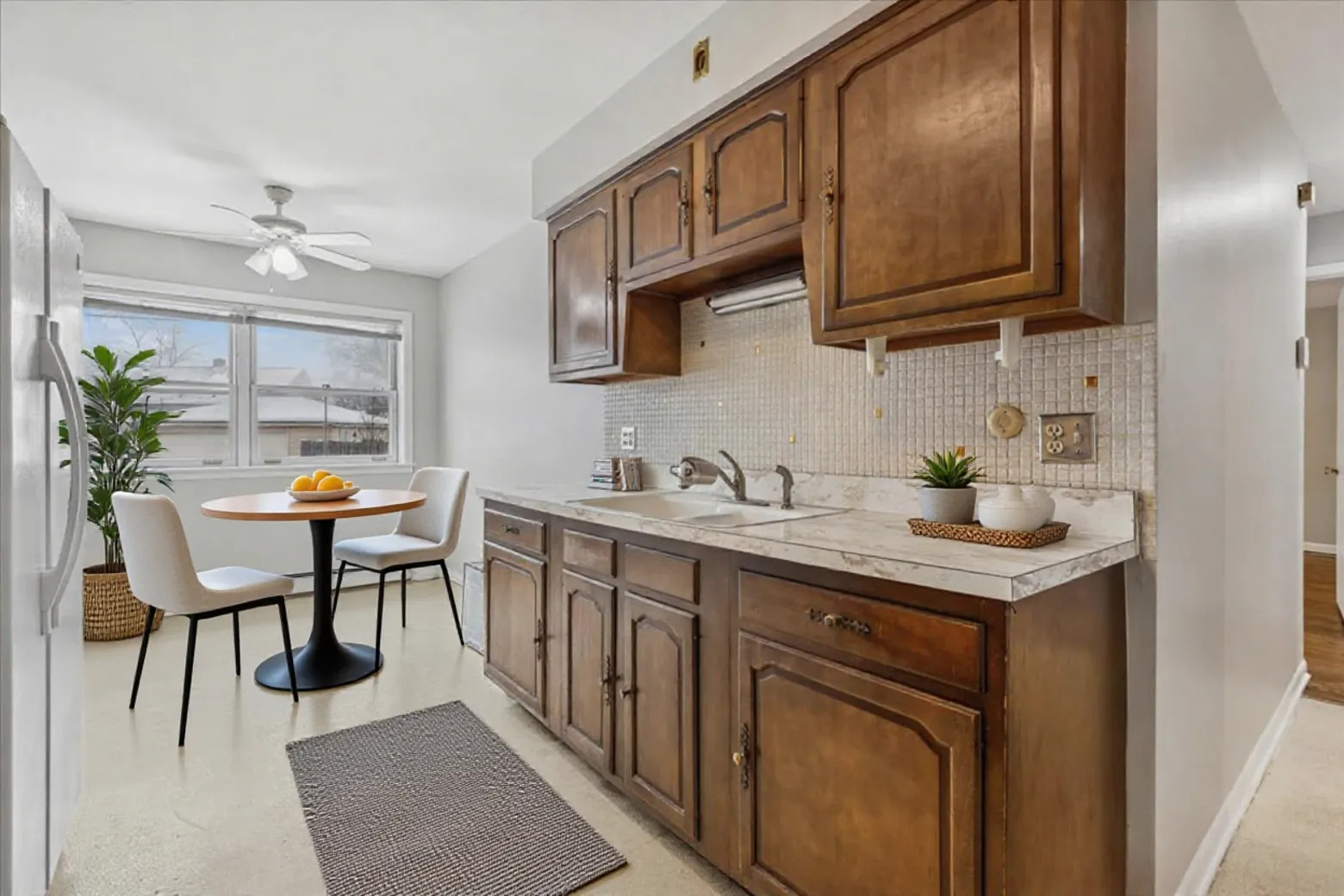 7801 Niles Center Road, Unit 102 Skokie, IL 60077 - Photo 8 of 20 a kitchen with stainless steel appliances granite countertop a sink and cabinets