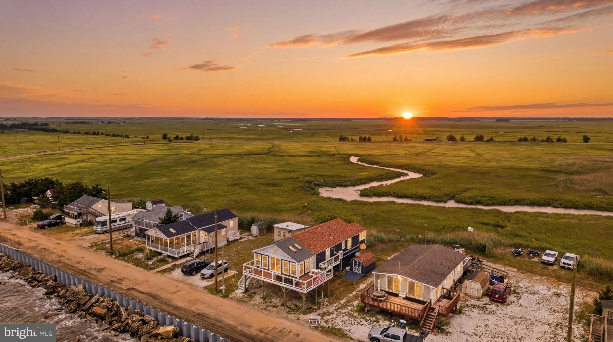 173 Cove Road Newport, NJ 08345 - Photo 70 of 72 an aerial view of ocean and residential houses with outdoor space