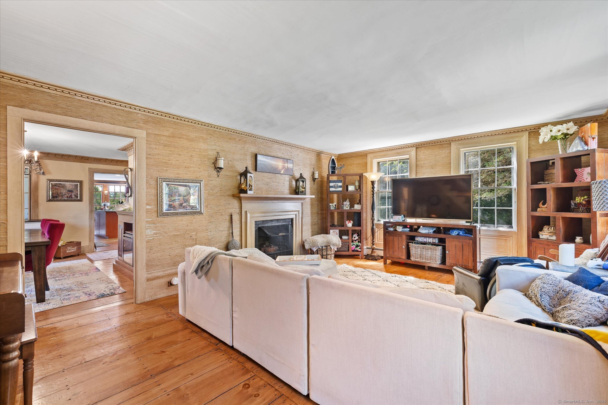 101 Child Hill Road Woodstock, CT 06281 - Photo 7 of 39 a living room with furniture a flat screen tv and a fireplace