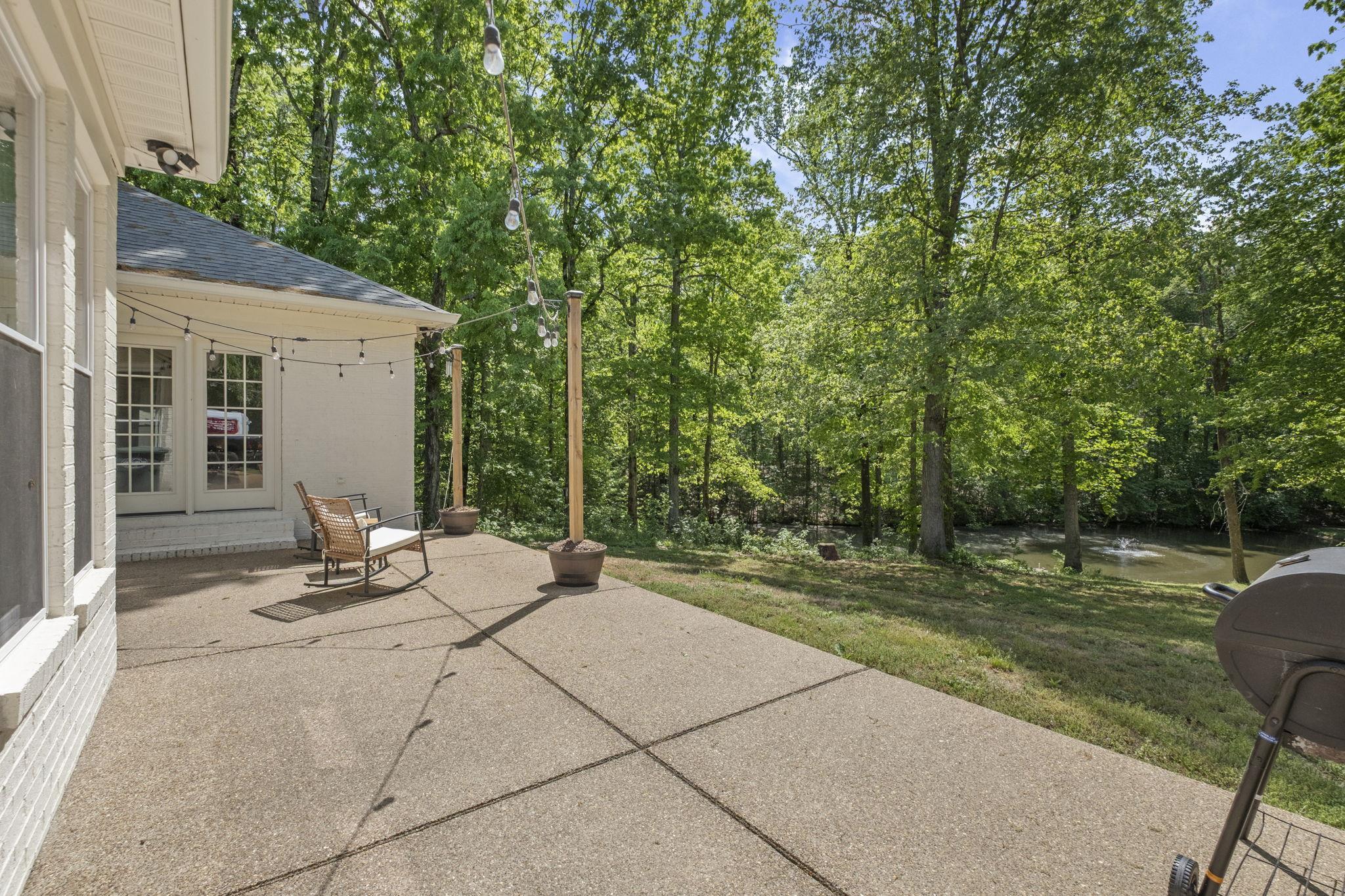 650 Firetower Road Somerville, TN 38068 - Photo 25 of 39 View of patio featuring view of wooded area