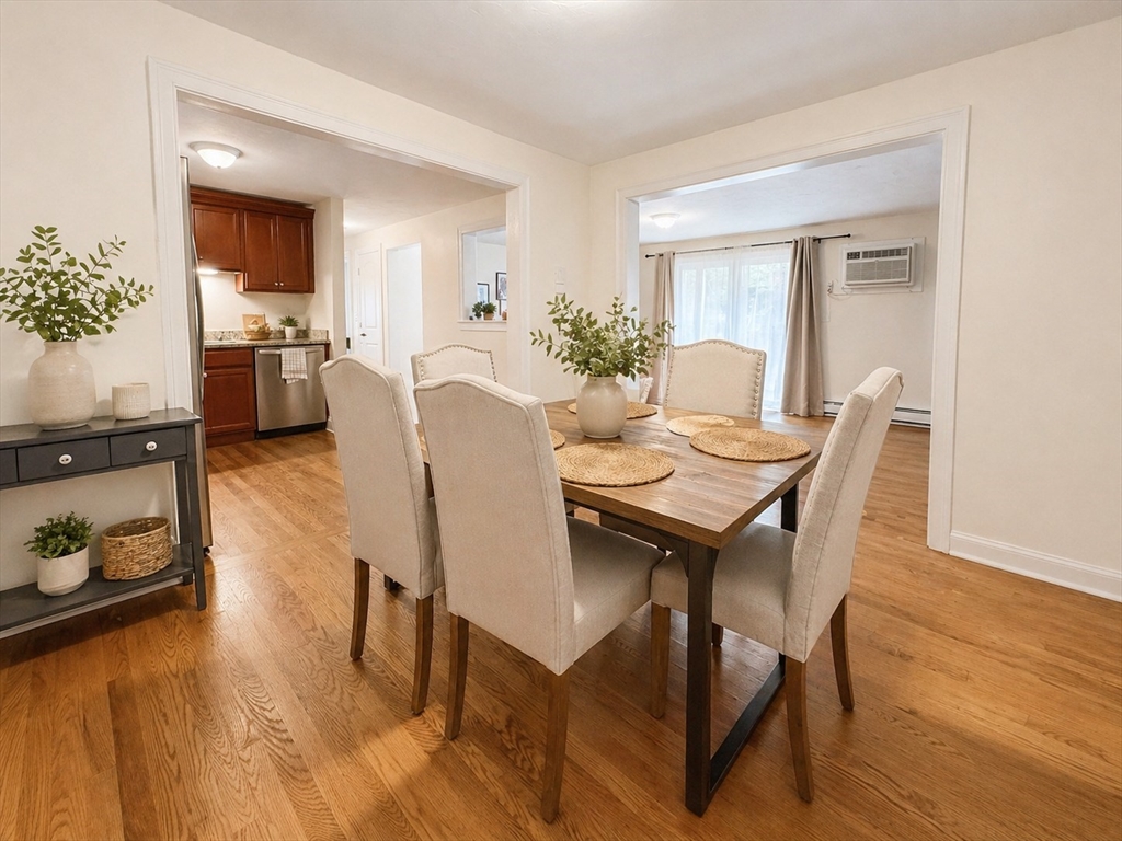 92 Sandwich Road, Unit 4D Bourne, MA 02532 - Photo 6 of 18 a view of a dining room with furniture and wooden floor