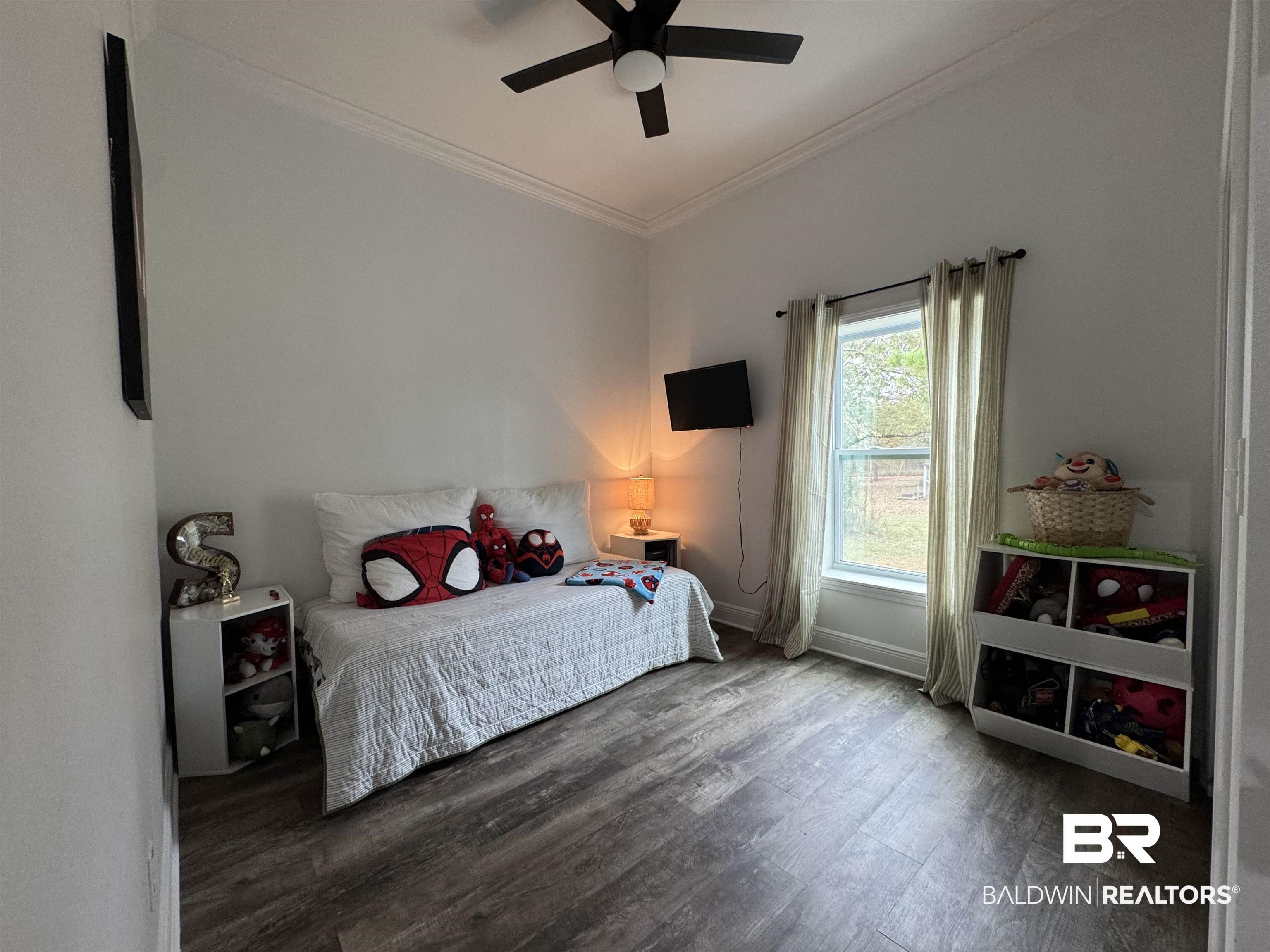 370 Dianne Road Frisco City, AL 36445 - Photo 23 of 41 Bedroom featuring hardwood / wood-style flooring, ceiling fan, and crown molding