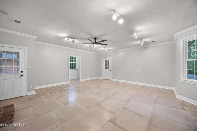 a view of an empty room with a window