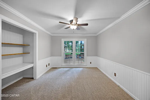 a view of an empty room with a window