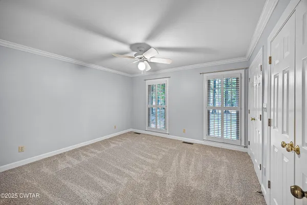 a view of an empty room with windows