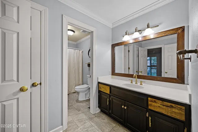 a bathroom with a double vanity sink and mirror