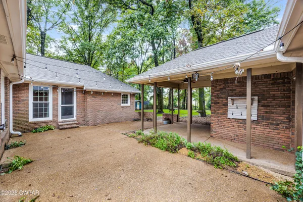 a backyard of a house with seating space