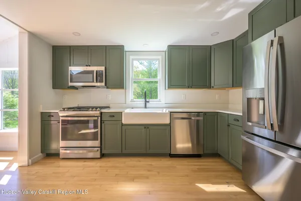 a kitchen with a stove and a refrigerator