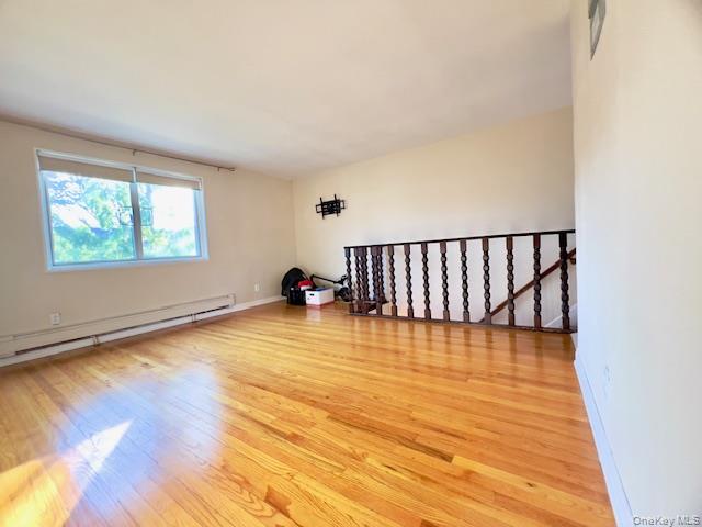 216-37 68th Avenue, Unit 2 Queens, NY 11364 - Photo 10 of 27 a view of a room with wooden floor and window