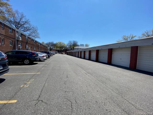 216-37 68th Avenue, Unit 2 Queens, NY 11364 - Photo 21 of 27 a view of parking space and yard