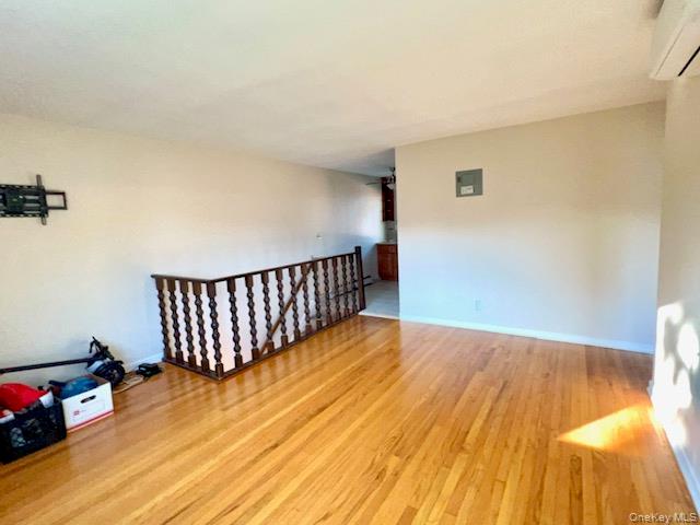 216-37 68th Avenue, Unit 2 Queens, NY 11364 - Photo 9 of 27 a view of a room with wooden floor and potted plant