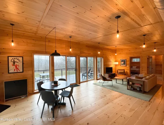 a room with lots of furniture and a chandelier
