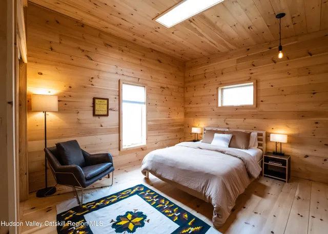 a bathroom with a sink a mirror and shower