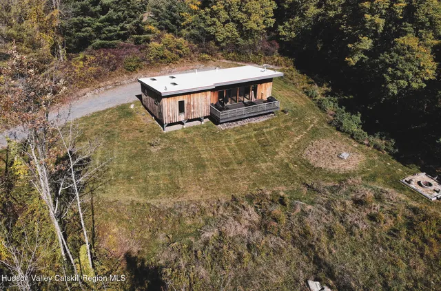 a view of staircase with wooden floor and a potted plant