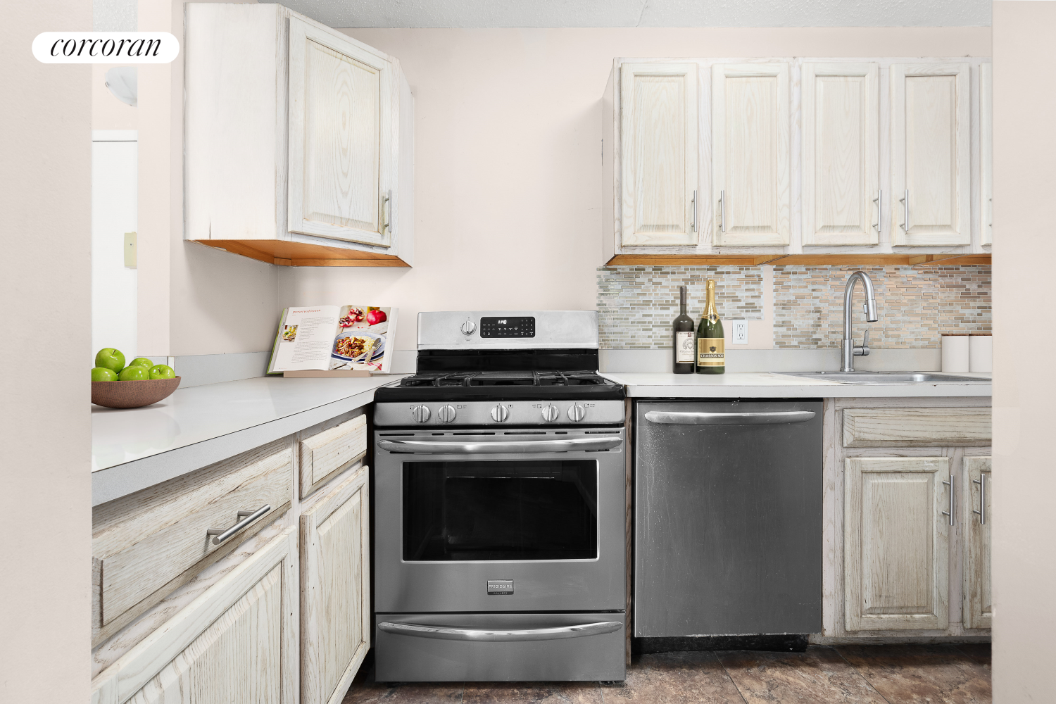 1901 Madison Avenue, Unit 218 Manhattan, NY 10035 - Photo 5 of 13 a kitchen with granite countertop white cabinets and white appliances