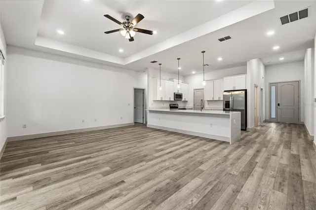 a view of kitchen with wooden floor and window