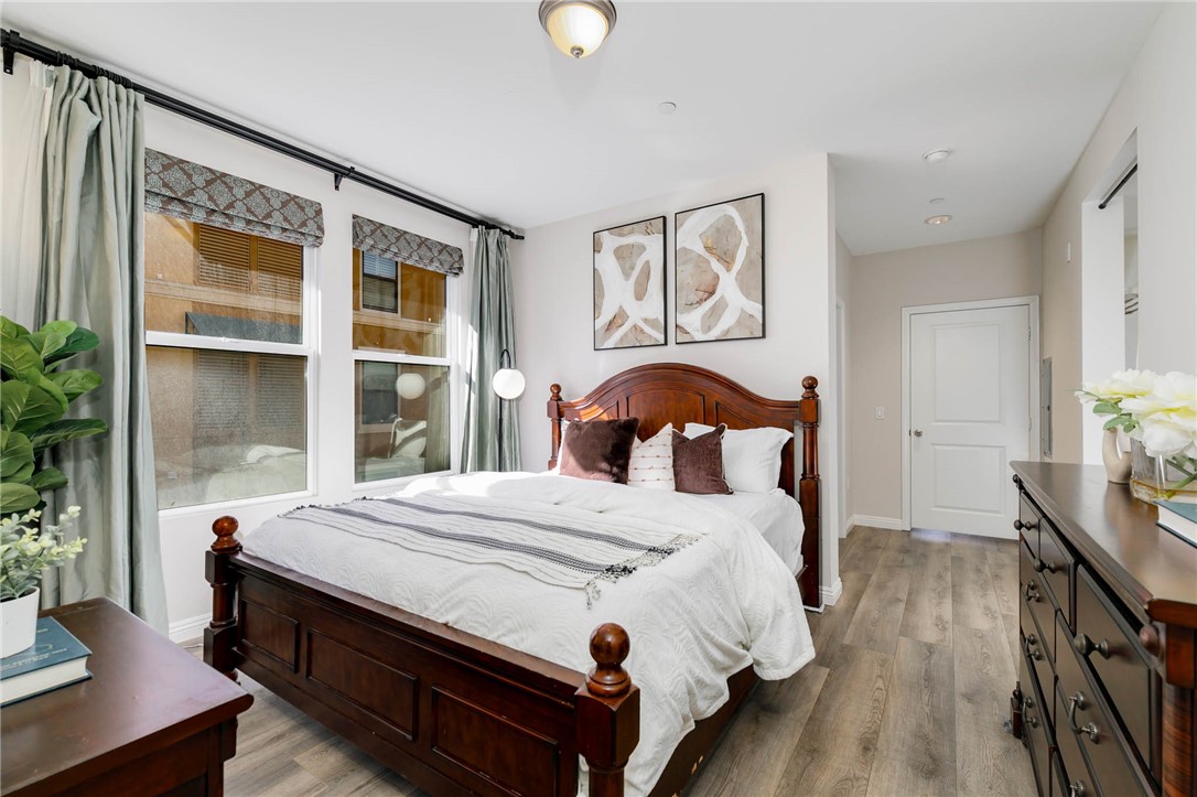 408 West Main Street, Unit 2G Alhambra, CA 91801 - Photo 14 of 30 a bedroom with a bed a dresser and next to a window