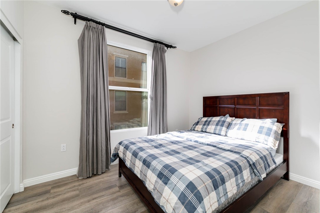 408 West Main Street, Unit 2G Alhambra, CA 91801 - Photo 19 of 30 a bedroom with a bed and a mirror