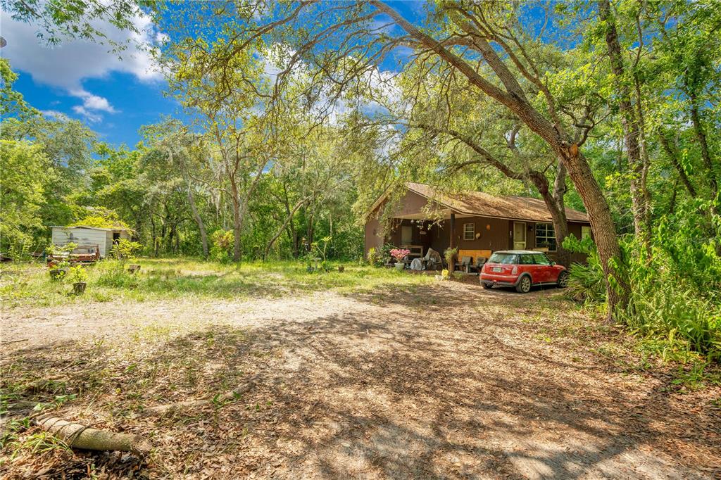 1 EAST Rd Spring Hill Hudson, FL 34667 - Photo 29 of 41 a view of a house with a yard