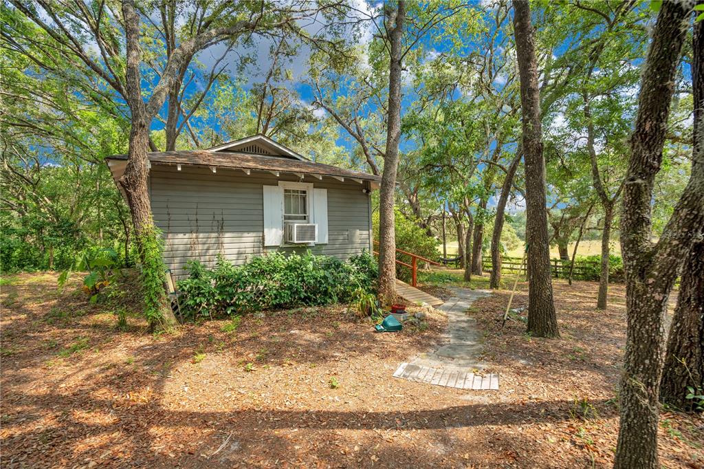 1 EAST Rd Spring Hill Hudson, FL 34667 - Photo 31 of 41 a view of a house with a yard