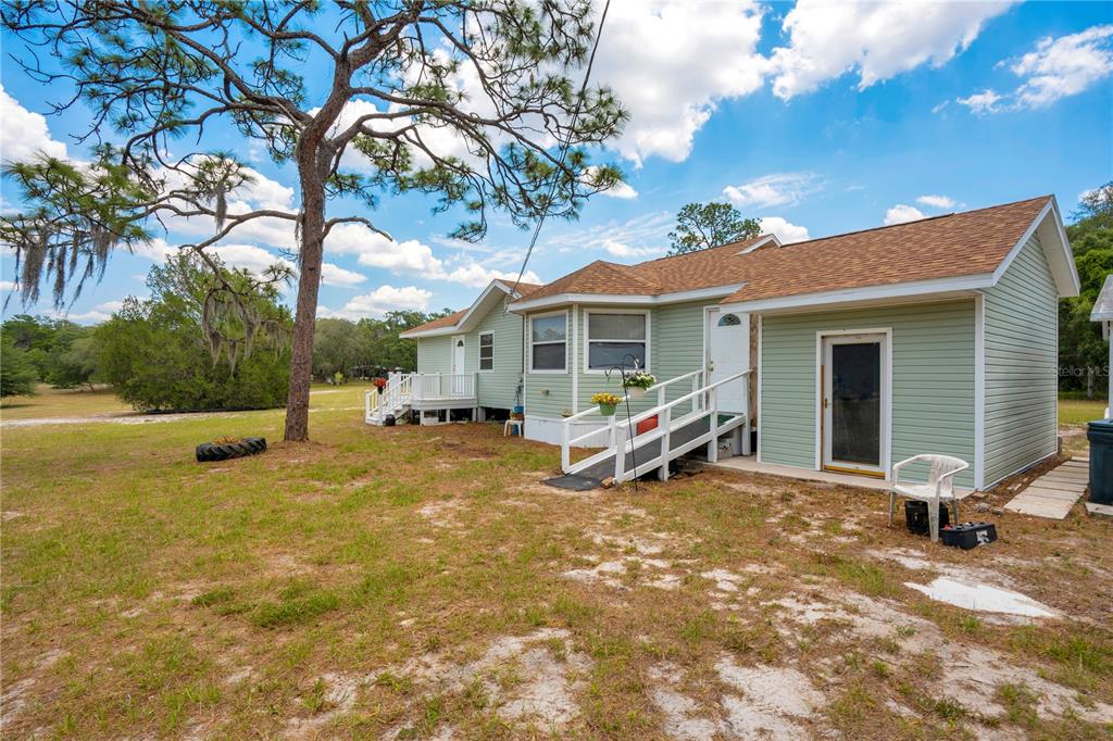 1 EAST Rd Spring Hill Hudson, FL 34667 - Photo 38 of 41 a view of a house with a patio