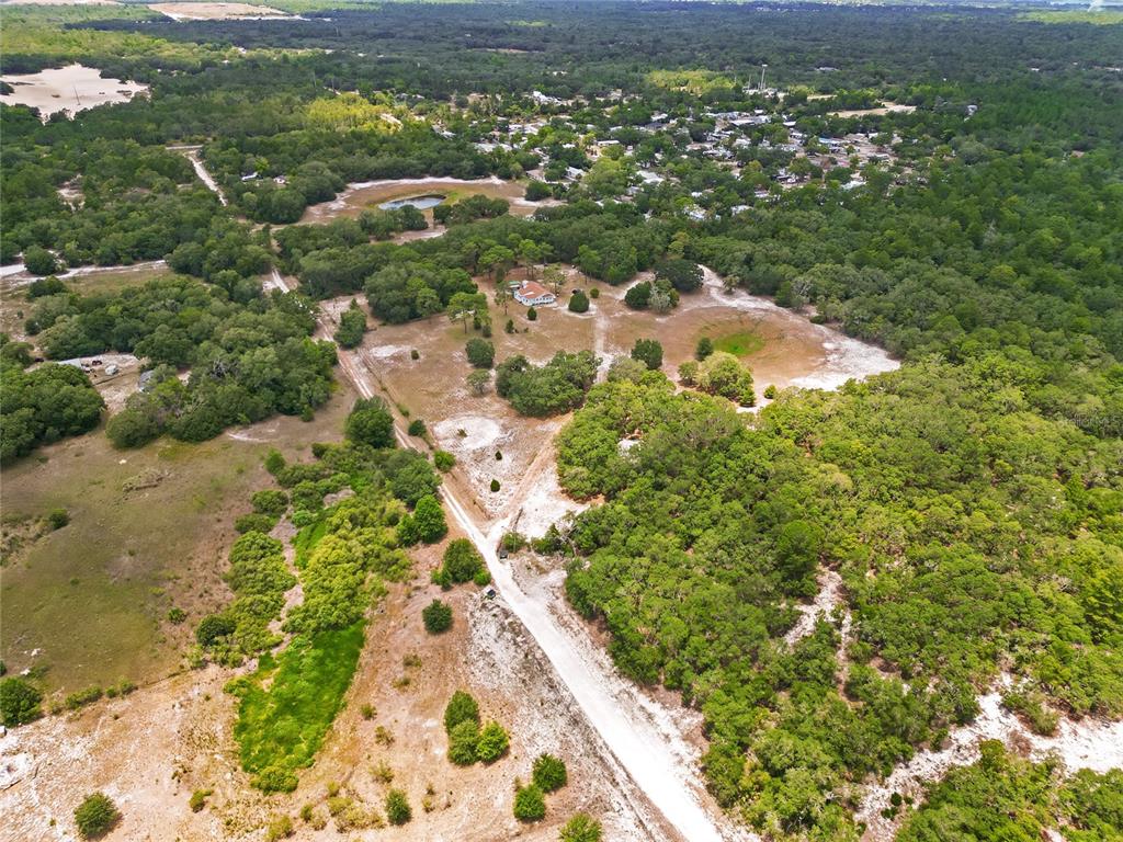 1 EAST Rd Spring Hill Hudson, FL 34667 - Photo 5 of 41 an aerial view of residential houses with outdoor space