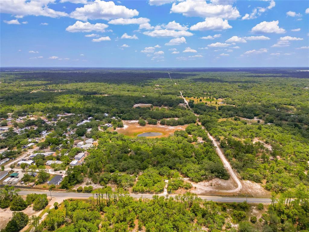 1 EAST Rd Spring Hill Hudson, FL 34667 - Photo 10 of 41 a view of a lake with a houses
