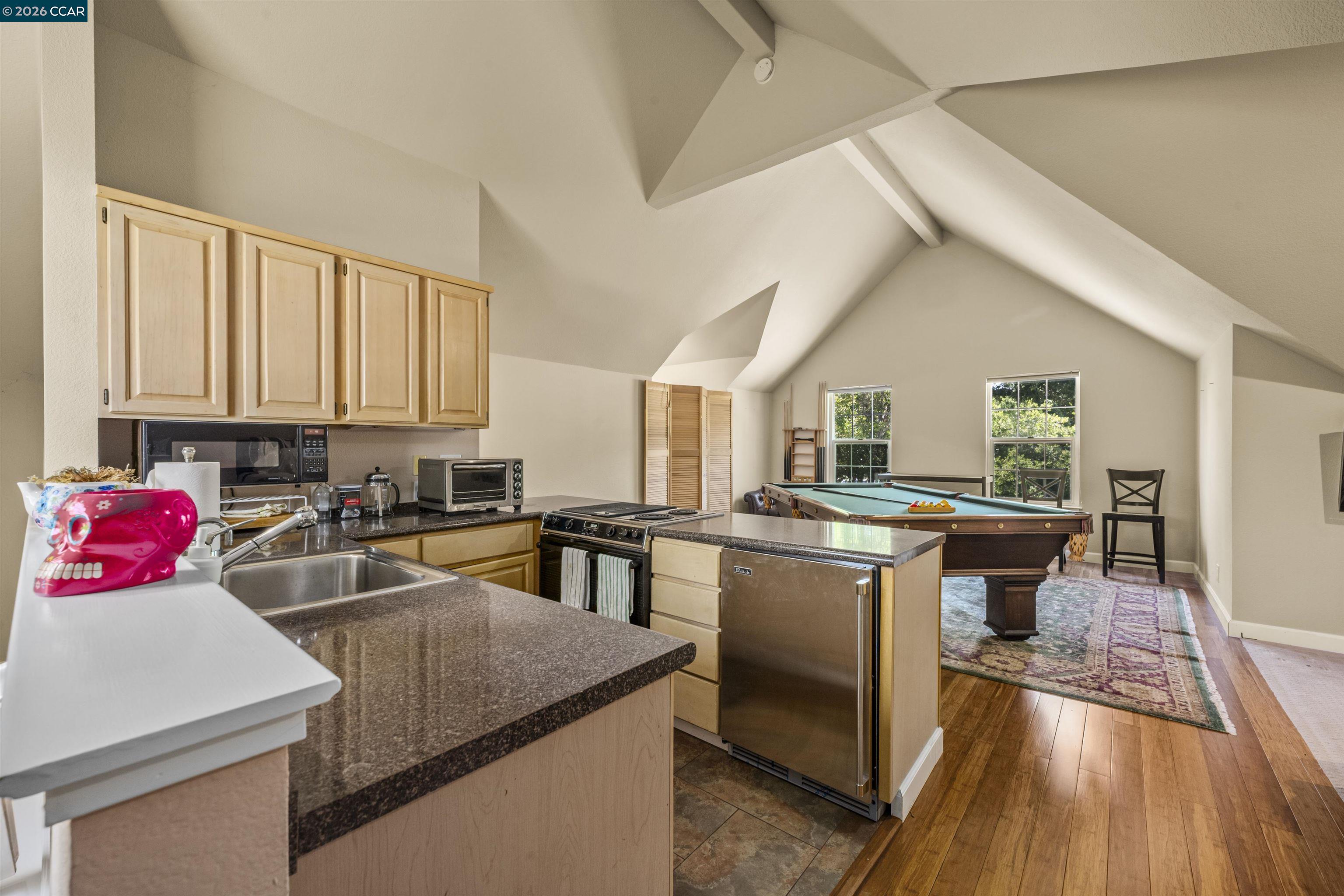 177 Oak Road Alamo, CA 94507 - Photo 43 of 85 a kitchen with a stove a sink dishwasher and a refrigerator with wooden floor