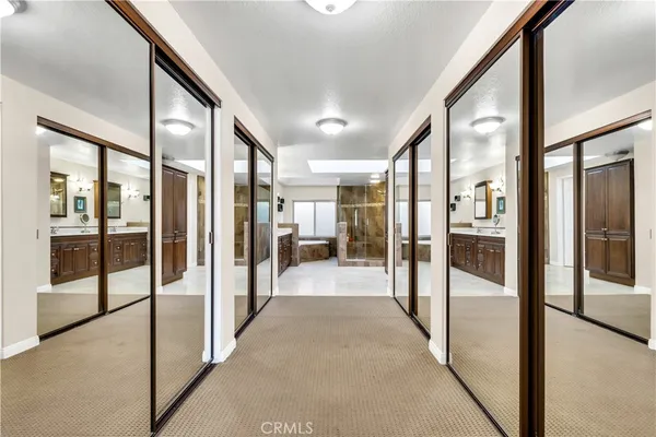 a view of a hallway with a chandelier