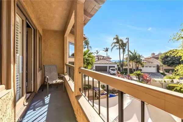 a living room with stainless steel appliances granite countertop furniture and a kitchen view