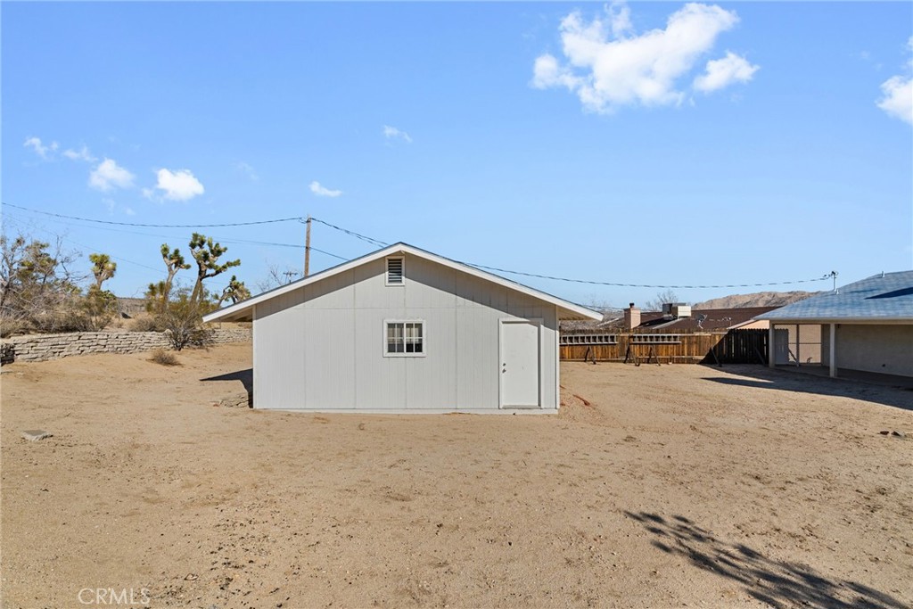 57622 Sierra Way Yucca Valley, CA 92284 - Photo 14 of 75 a view of a backyard of a house