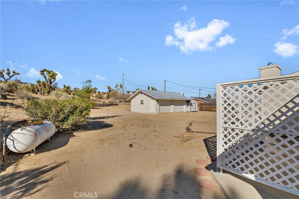 57622 Sierra Way Yucca Valley, CA 92284 - Photo 15 of 75 a view of a couch in front of a house