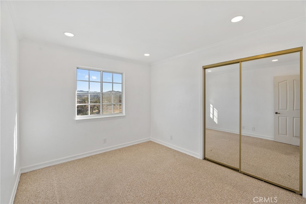 57622 Sierra Way Yucca Valley, CA 92284 - Photo 19 of 75 an empty room with windows