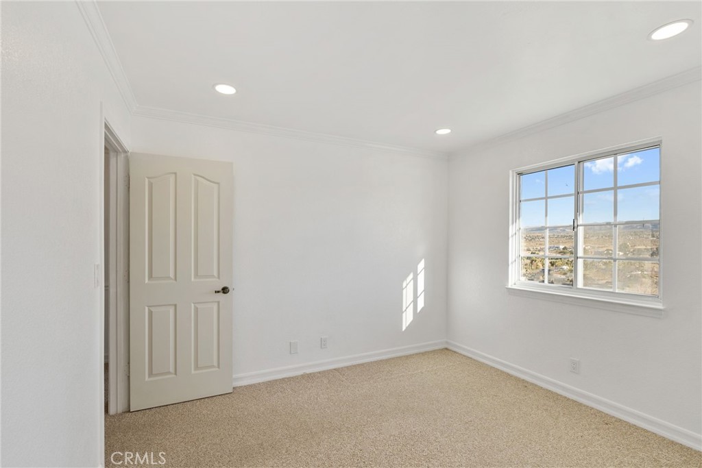 57622 Sierra Way Yucca Valley, CA 92284 - Photo 21 of 75 an empty room with windows