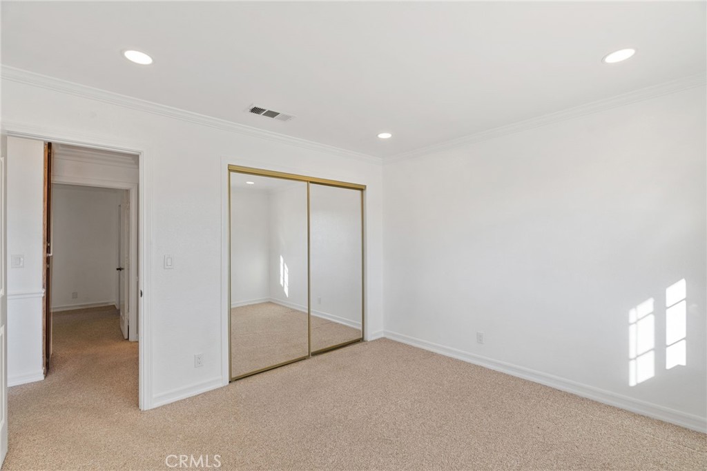 57622 Sierra Way Yucca Valley, CA 92284 - Photo 23 of 75 an empty room with sliding glass door and shower