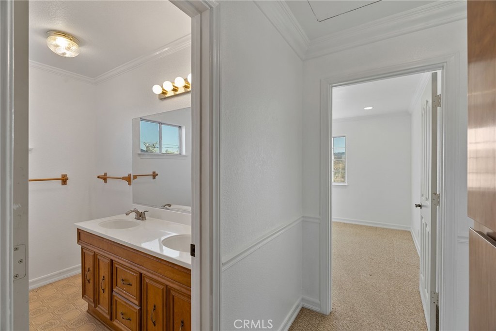 57622 Sierra Way Yucca Valley, CA 92284 - Photo 36 of 75 a bathroom with a sink and a mirror