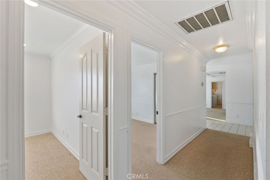 57622 Sierra Way Yucca Valley, CA 92284 - Photo 37 of 75 a view of a hallway with white walls