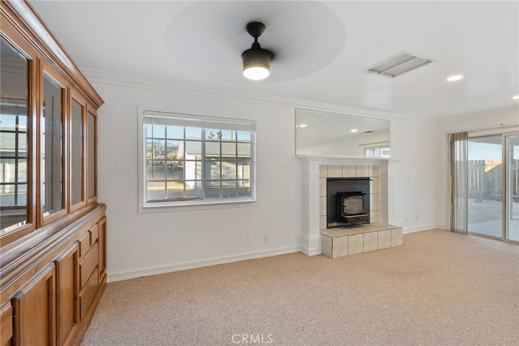 57622 Sierra Way Yucca Valley, CA 92284 - Photo 43 of 75 a view of an empty room with a fireplace and a window