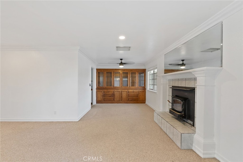 57622 Sierra Way Yucca Valley, CA 92284 - Photo 44 of 75 a view of an empty room with a fireplace and a window