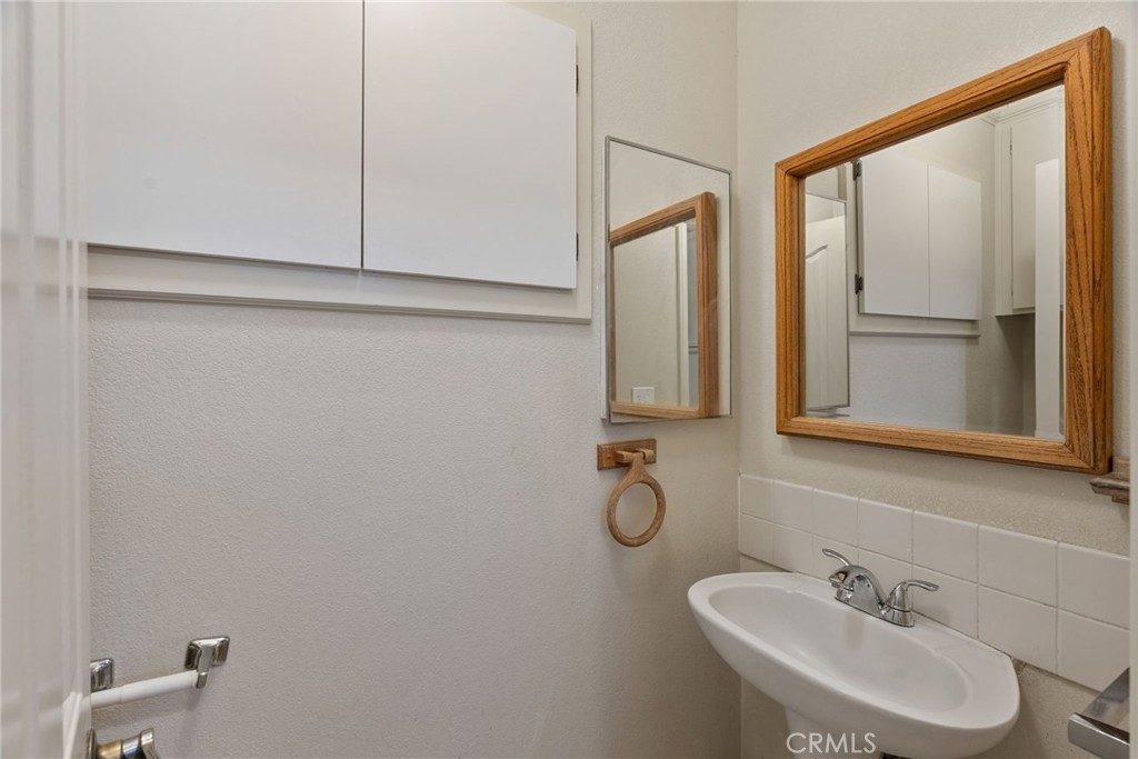57622 Sierra Way Yucca Valley, CA 92284 - Photo 62 of 75 a bathroom with a sink and a mirror
