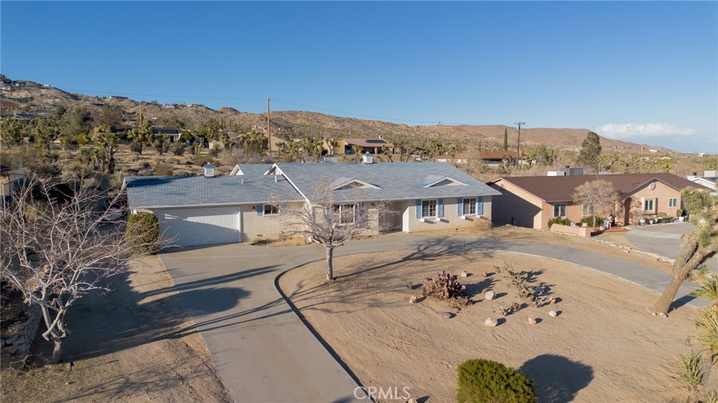 57622 Sierra Way Yucca Valley, CA 92284 - Photo 66 of 75 an aerial view of a house with a big yard