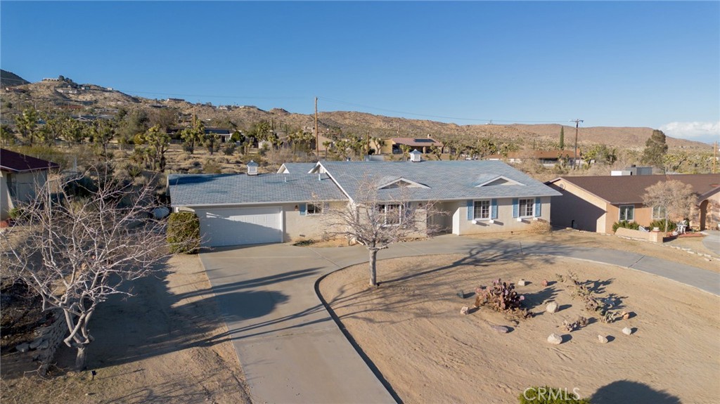57622 Sierra Way Yucca Valley, CA 92284 - Photo 67 of 75 an aerial view of a house with a big yard