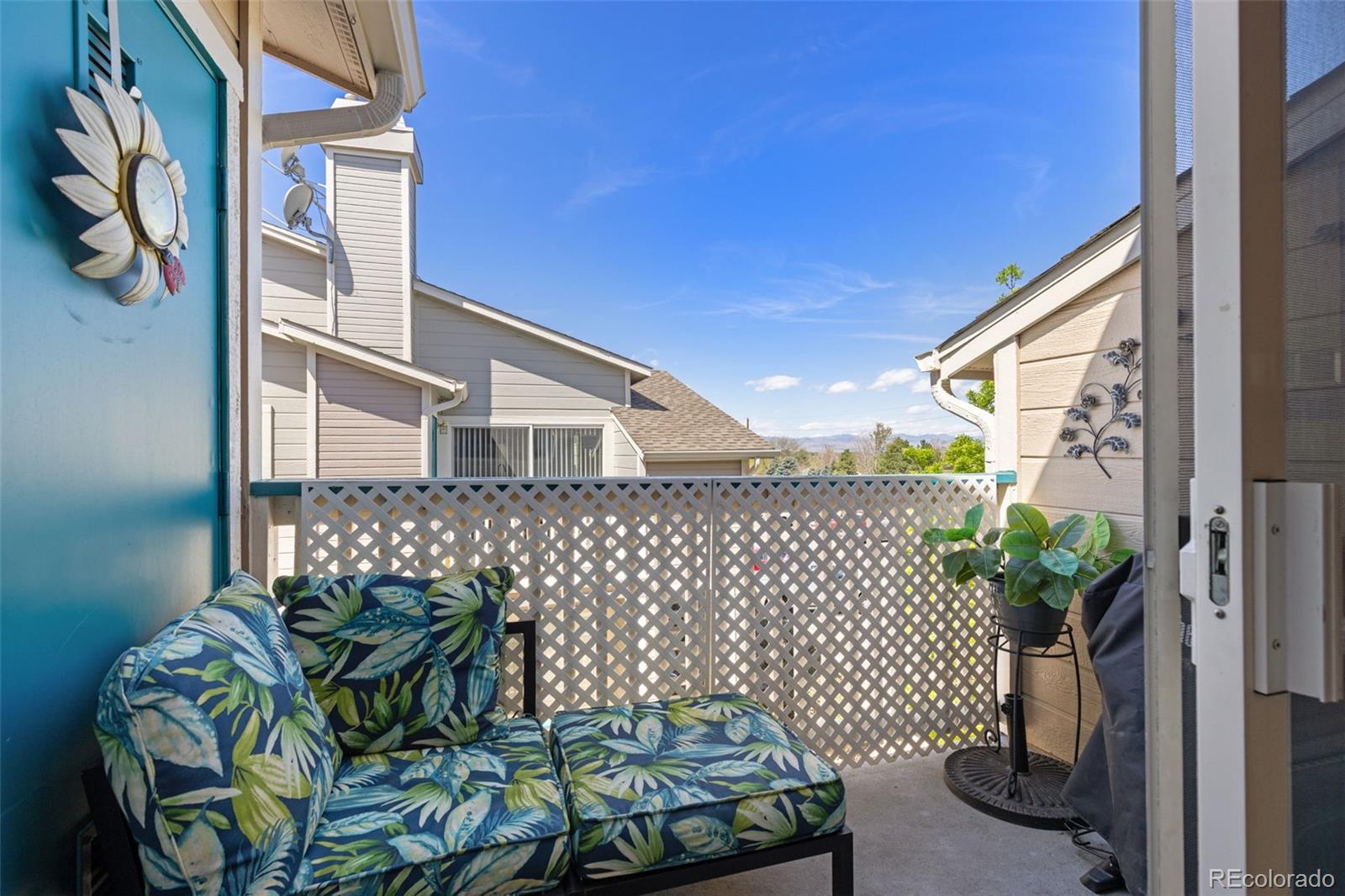 8334 Pebble Creek Way, Unit 201 Highlands Ranch, CO 80126 - Photo 12 of 28 a house with glass top table and chairs